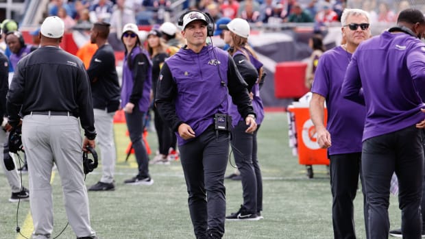 Ravens defensive coordinator Mike McDonald paces the sideline.